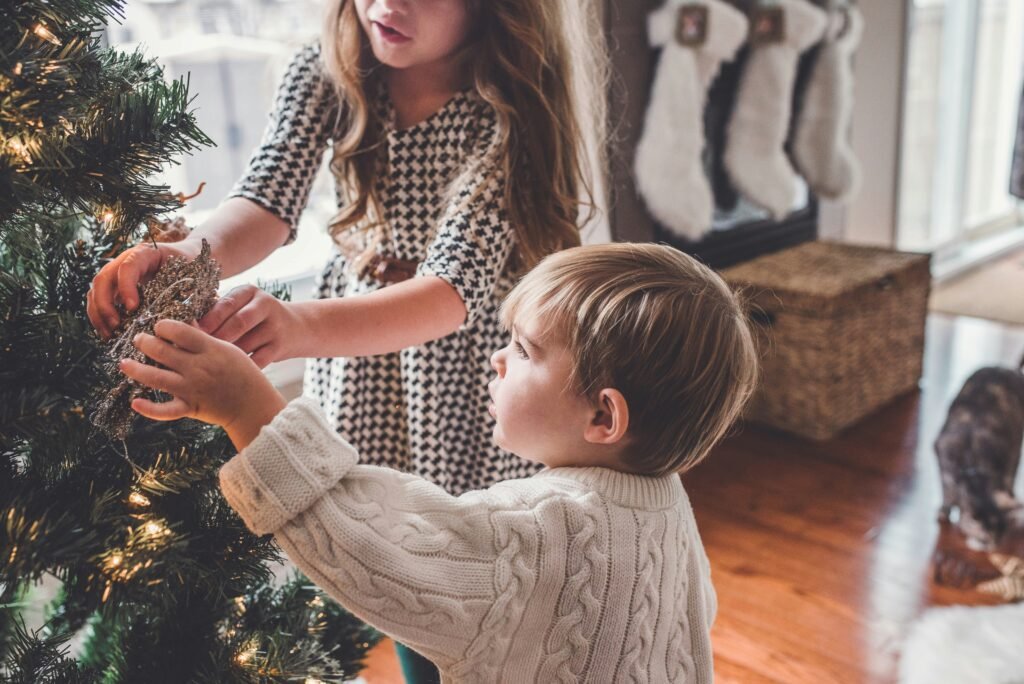 kids decorating christmas tree